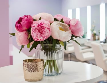 a vase with pink flowers in a salon