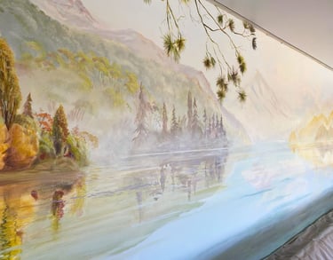 Angled view of pool mural showing New Zealand lake, misty mountains and trees.