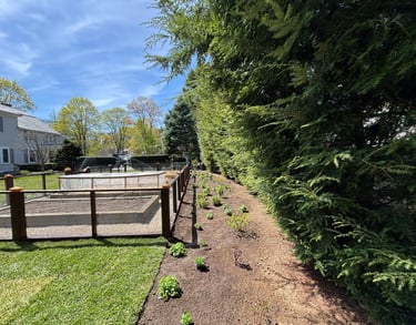 landscaping-along-fenced-in-garden.jpg