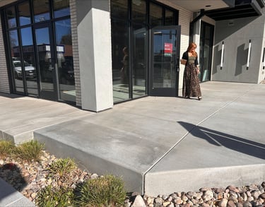 Owner Mindy Bryant standing in front of the new Loveland Edge Optics location