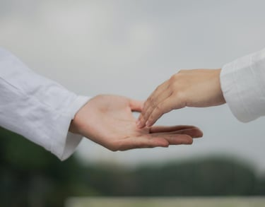 a person holding a hand with a hand holding a hand