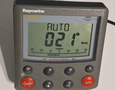 a raymarine auto pilothead st6002 powered on with data on screen 