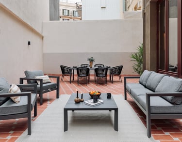 Private terrace with seating, dining area and plants, designed by SAVIA