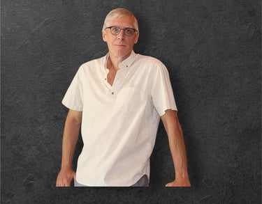 a man in a white shirt and glasses