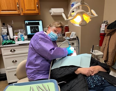 A patient receiving dental care at the center for hope and healing