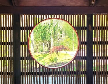 Huntsville, AL - A round window inside the Japanese Tea House frames the scenery outside