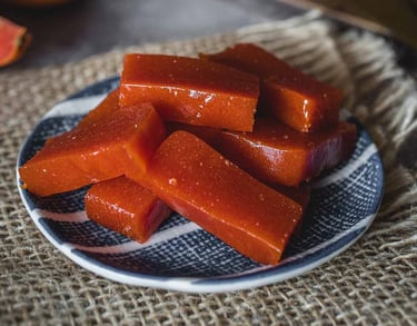 a plate with slices of pink guava paste
