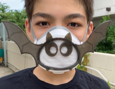 flo-2: boy with Flomask ,Batwings with eyes decoration