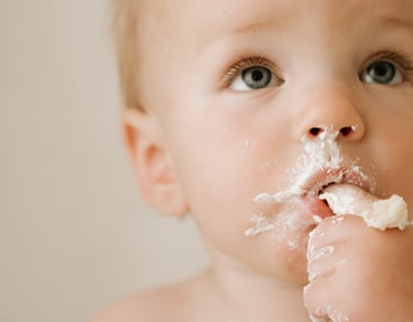 baby eating cake at his cake smash photography session in Adelaide Hills