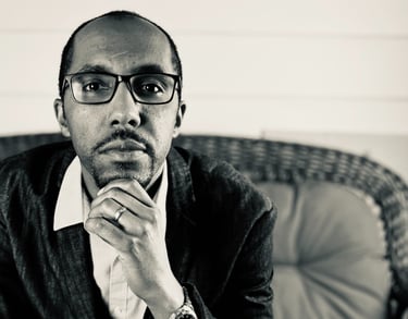 Portrait of J Allen Phelps, author of "The Girl No Boy Could love," exuding creativity and warmth. 