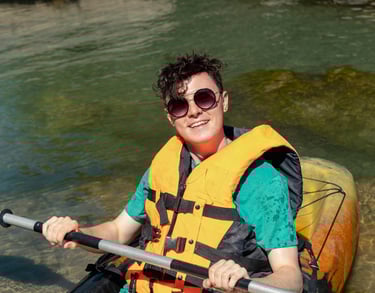 Person kayaking with UV protection in their sunglasses