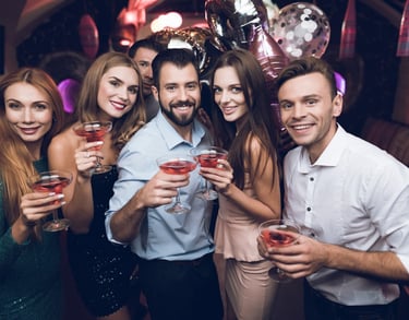 Party Bus Booking Las Vegas group celebration photo inside a party bus holding drinks