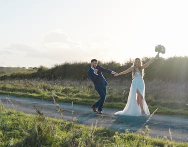 Bride and groom walking along celebrating getting married