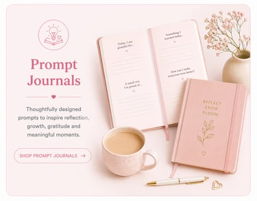 Pink aesthetic gratitude journal with writing prompts, a cup of coffee, and flowers for daily reflection.