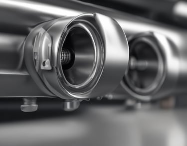 Close-up of a skilled technician repairing a car's bodywork in a workshop.