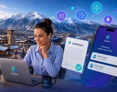 A remote worker managing digital energy contracts on a laptop and smartphone with snowy mountains in the background.