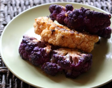 a plate of pan-fried-spiced purple and white cauliflower steak