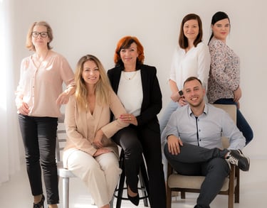a group of people sitting on a bench in a room