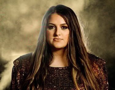 a woman with long hair and a sequinous dress