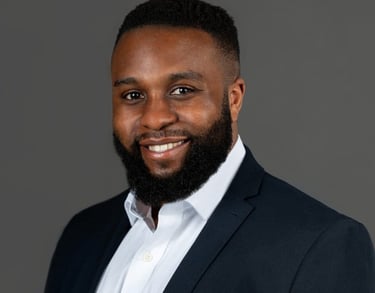 a man with a beard and a suit