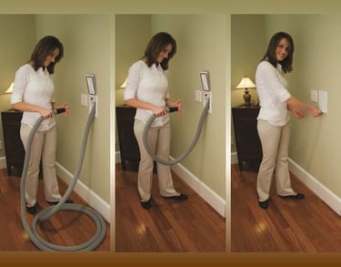 a woman is using a vacuum cleaner to clean her house