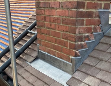 Replacing chimney flashing in progress