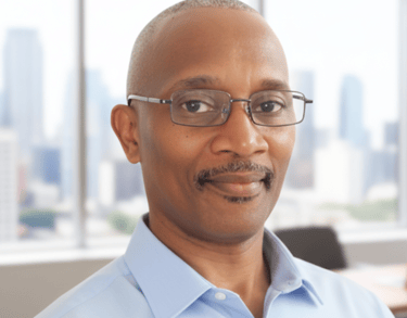 Self-Published author and founder of Christians Codes Books in a blue shirt and glasses