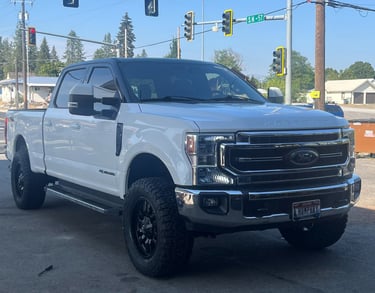 a ford power stroke with a lift kit and new tires from premier tire in sandpoint idaho