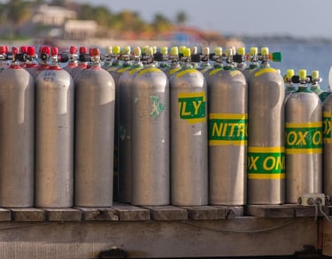 a bunch of gas bottles of gas on a trailer