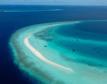 a small island with a small island in the middle of the ocean
