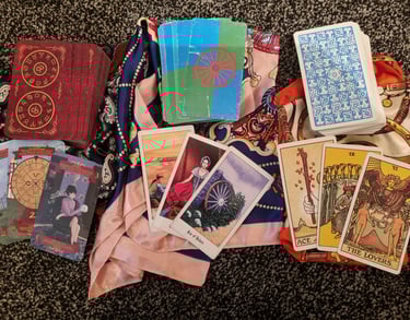 picture of 3 sets of tarot cards front and back