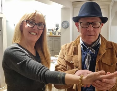 Rob Hamilton reading the palm of a female client