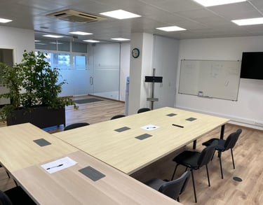 a conference room with a large table and chairs