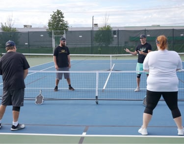 The Pickleball Experience Pro Coaches- Teaching a pickleball lesson
