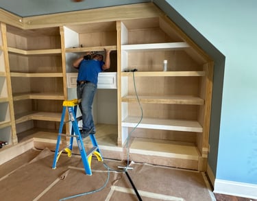 Professional carpenter working on a custom closet wall unit- Britto's Home Improvement