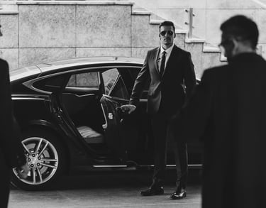 a bodyguard is standing in front of a car