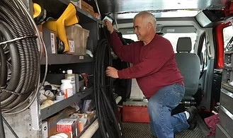 John in his plumbing truck
