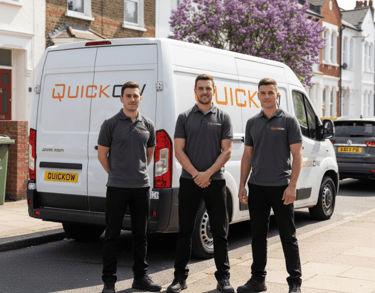 Quickow moving team posing in front of their branded removal van.