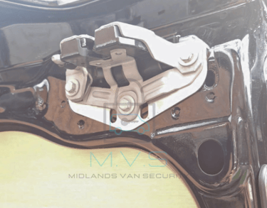Van barn door latch shield