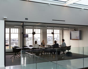 Business Meeting in a Glass Room