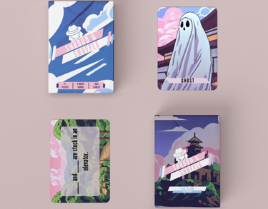 Two decks of Shroud & Shuffle. The base deck and tag team expansion deck with one card from each.