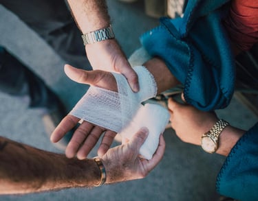 a man is holding a bandage in his hand