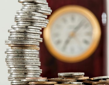 a stack of coins sitting on top of a pile of coins