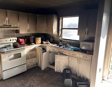 a kitchen with a stove top oven and a stove top