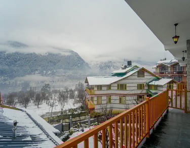private balcony view from cottage in Manali with mountains