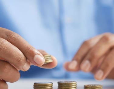gold coins on table representing beginners guide to gold ira