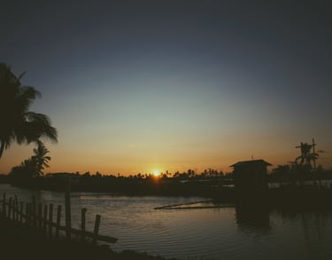 A small hut by the water body under the sunset, Kadamakkudy, Kerala, India