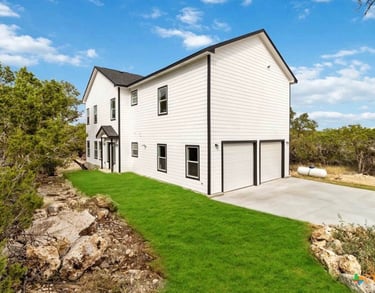 Custom home in Wimberley, Texas with solar panels and large backyard