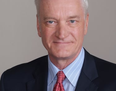 Photo of Dr. Garrick Villaume in suit and tie.