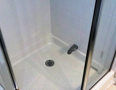 Shower stall resurfaced in white sands maintenance free finish